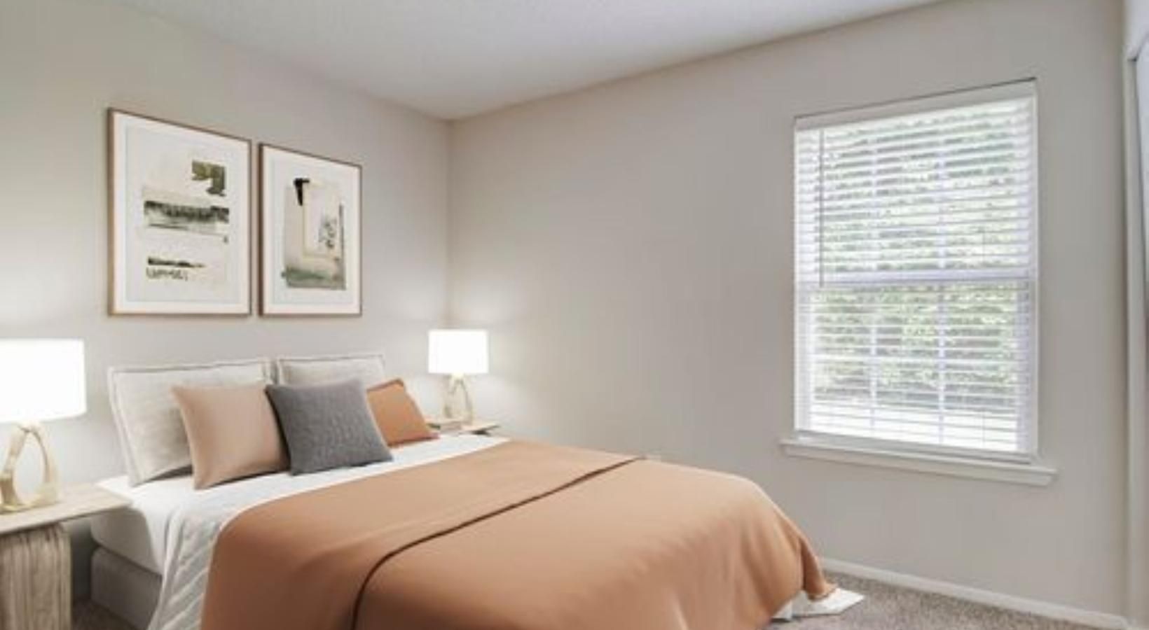 a bedroom with a bed and lamps