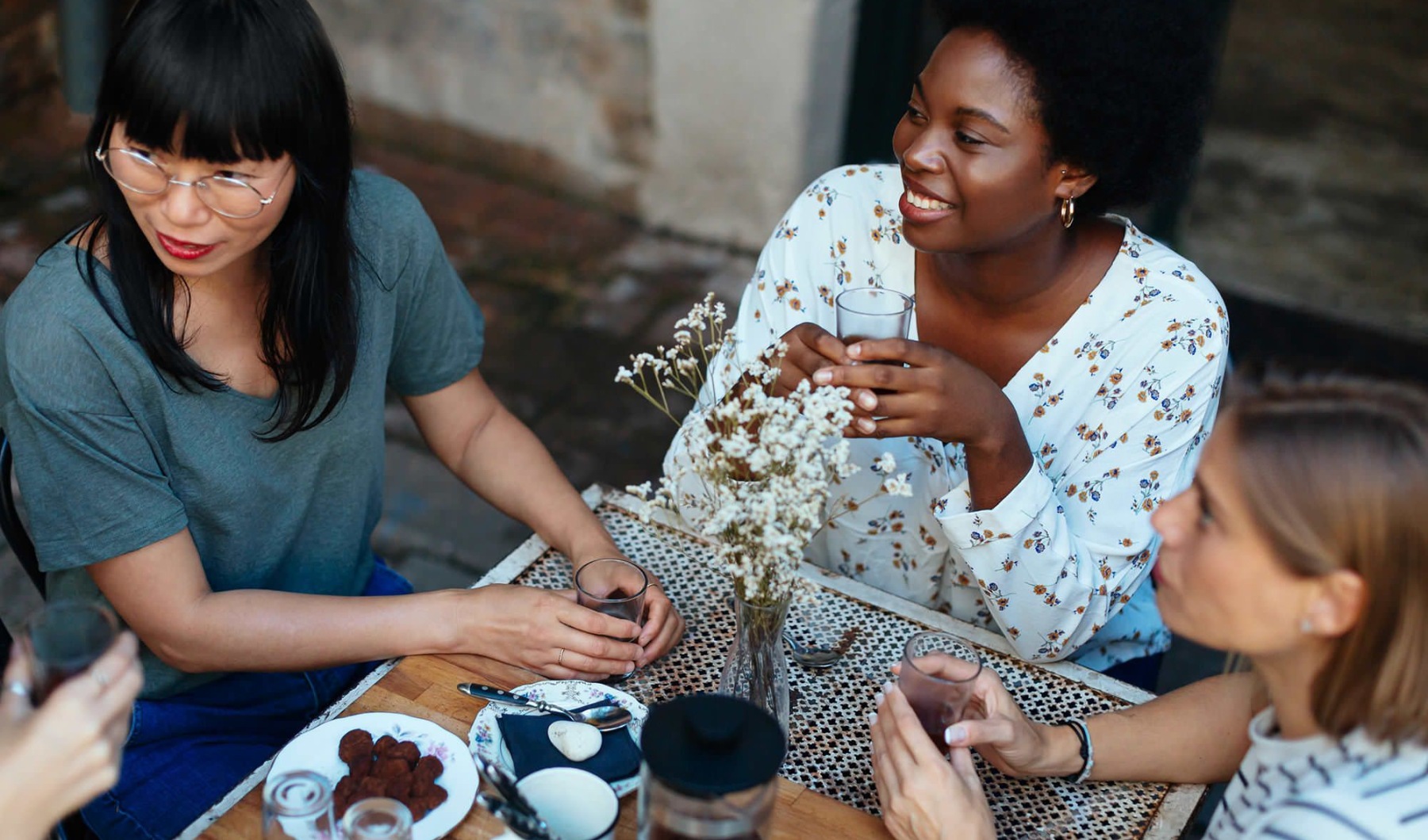A group of women  drinking coffee